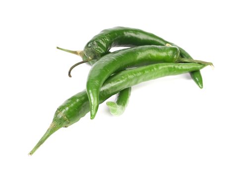 Four green peppers. Isolated on a white background.