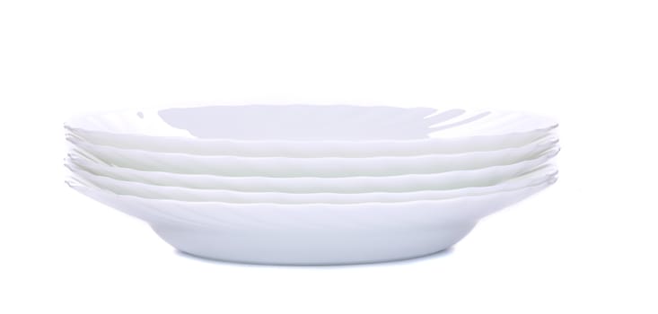 Empty plate isolated on a white. Isolated on a white background.