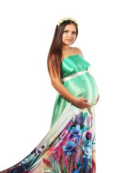 Beautiful young pregnant woman. Isolated on a white background.