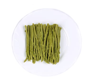 Canned asparagus on plate. Isolated on a white background.