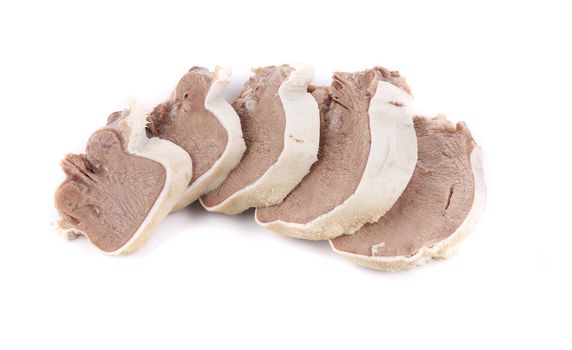 Raw chopped cow tongue close up. Isolated on a white background.