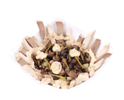 Meat salad with mushrooms and spicies. Isolated on a white background.