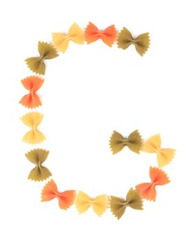 Letter G from the colorful pasta. Isolated on a white background.