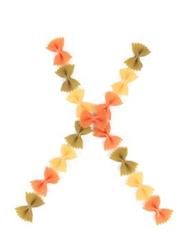 Letter X from the colorful pasta. Isolated on a white background.