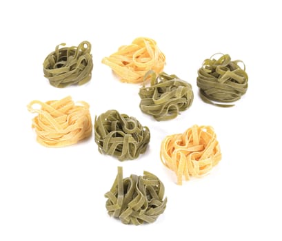 Tagliatelle paglia italian pasta. Isolated on a white background.