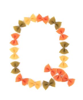 Letter Q from the colorful pasta. Isolated on a white background.