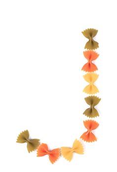 Letter J from the colorful pasta. Isolated on a white background.