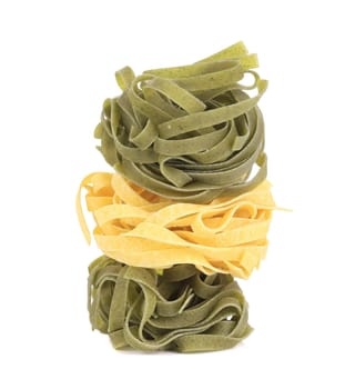 Tagliatelle paglia italian pasta. Isolated on a white background.