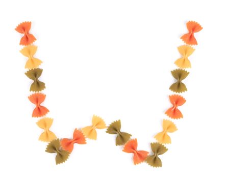 Letter W from the colorful pasta. Isolated on a white background.
