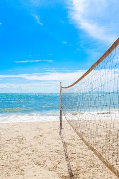 beach volleyball net on the beach with blue sky