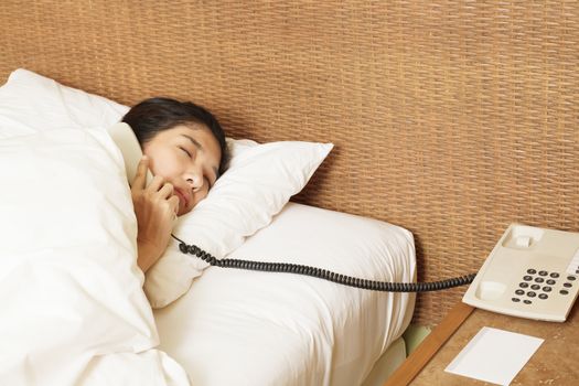 woman sleeping in bed and phone