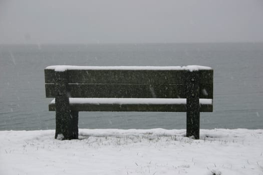 Park bench with snow