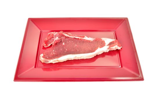 chop raw cow on red tray isolated on white background