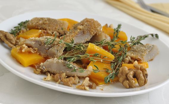 Herring in the pumpkin gratin with nut sauce