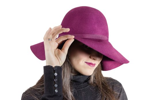 Portrait of beautiful young girl with a garnet hat in her head, isolated on white background