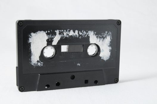 Ancient Vintage Used Musicassette over a White Background