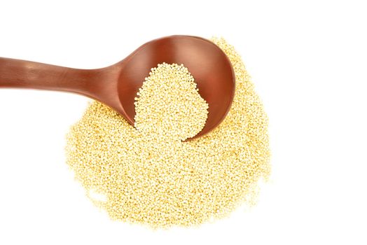 quinoa grain with a wooden spoon on white background