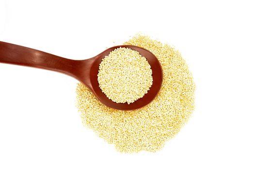 Quinoa grains and wooden spoon isolated on white background 