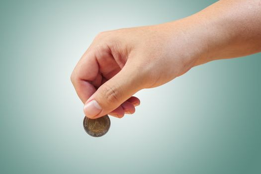 Saving money, hand putting coin
