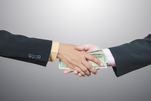 businessman hand and money to other for corruption concept