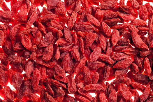 a lot of of red goji berry isolated on white background close up