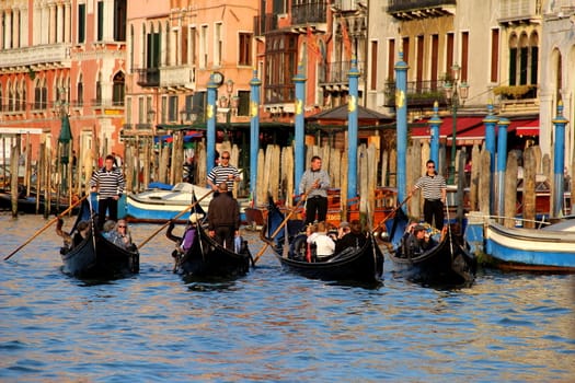 four gondolas in venice canal