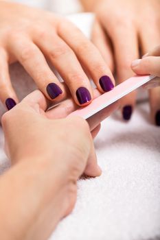 manicure making in beauty spa salon macro closeup 