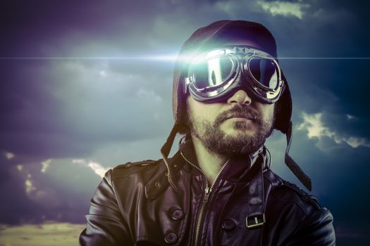 Flight, man dressed as pilot in helmet on clouds background. Vintage pilot (aviator) concept