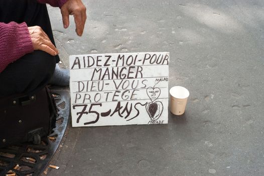 Beggar in Tronchet street, Paris. France