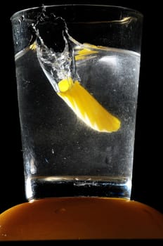 Healthy Food Italian Pasta Splashing in Water over a Black Background