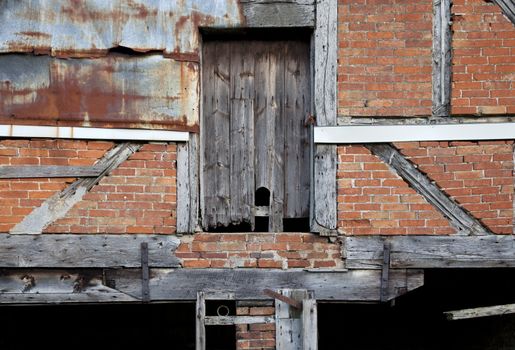 Dilapidated Warwickshire barn facade, England.