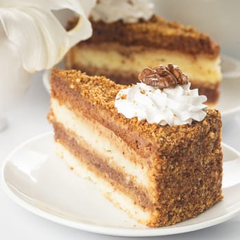 Slice of walnut cake in a white plate