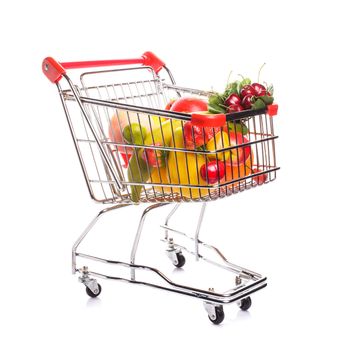 Shopping trolley with fruits isolated on white