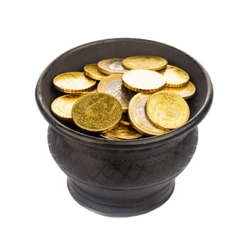 Black ceramic pot with golden coins isolated on white