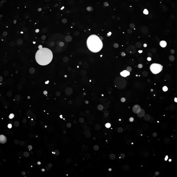Snow background - snowflakes over night dark sky
