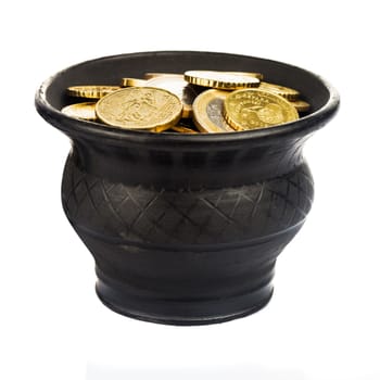 Black ceramic pot with golden coins isolated on white