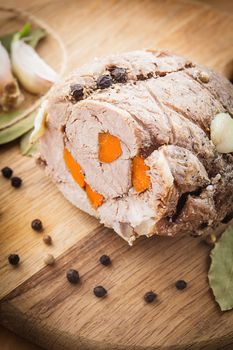 Roasted meat roll with carrot and spices