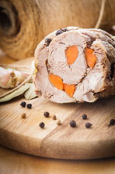 Roasted meat roll with carrot and spices