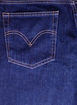 Texture of blue jeans pocket close up