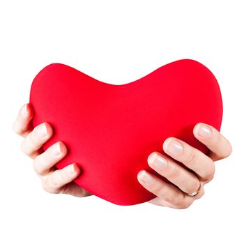 Teenage girl  hands with red heart toy isolated on white. Valentine's day concept. Give you my heart.