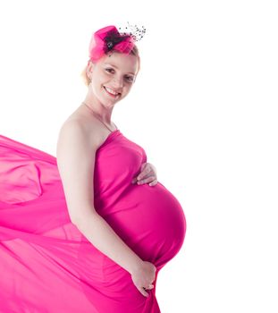 Pregnant woman in fuchsia dress with plume isolated on white