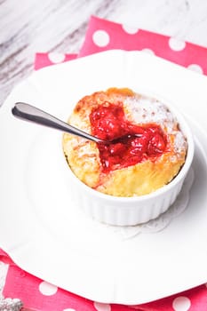 Cupcake with strawberry jam dip in heart shape