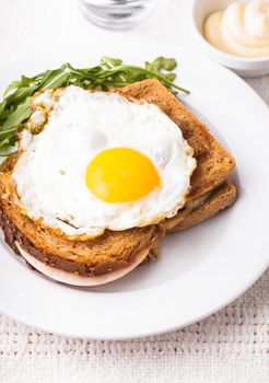 Croque Madame - sandwich with ham, cheese and fried egg