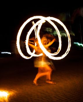 The girl dance with burning balls, fireshow