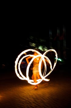 The girl dance with burning balls, fireshow