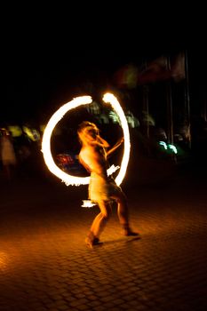 The girl dance with burning balls, fireshow