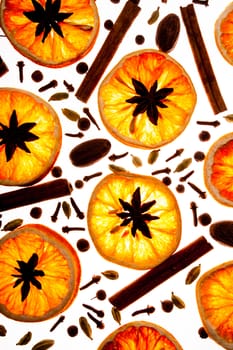 Christmas background with spices and dry orange's slices