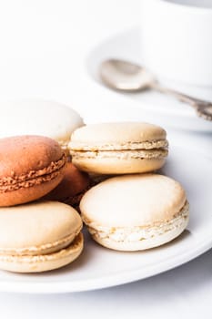 Three colors of macaroons in brown and beige tones