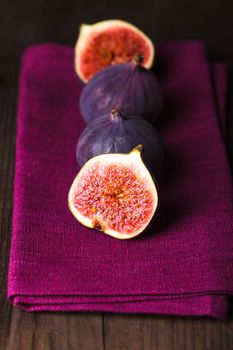 Slice of purple figs on background closeup