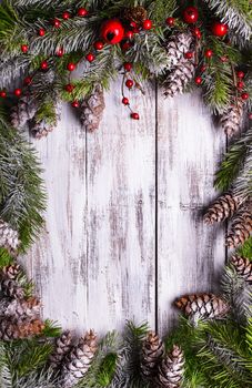 Christmas frame design with snow covered pinecones